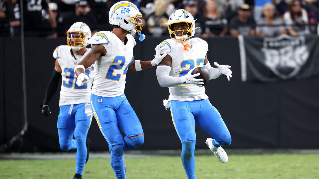 LAS VEGAS, NEVADA - SEPTEMBER 15: Tony Jefferson #23 of the Los Angeles Chargers reacts with Benjamin St-Juste #24 after intercepting a pass intended for Dont'e Thornton Jr. #10 of the Las Vegas Raiders during the second quarter at Allegiant Stadium on September 15, 2025 in Las Vegas, Nevada.