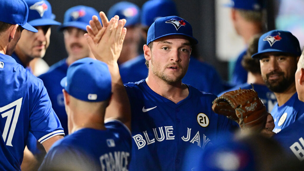 TAMPA, FLORIDA - SEPTEMBER 15: Trey Yesavage #39 of the Toronto Blue Jays high-fives teammates in the dugout following the first inning against the Tampa Bay Rays during his Major League Debut at George M. Steinbrenner Field on September 15, 2025 in Tampa, Florida.
