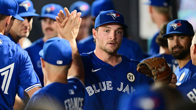 TAMPA, FLORIDA - SEPTEMBER 15: Trey Yesavage #39 of the Toronto Blue Jays high-fives teammates in the dugout following the first inning against the Tampa Bay Rays during his Major League Debut at George M. Steinbrenner Field on September 15, 2025 in Tampa, Florida.