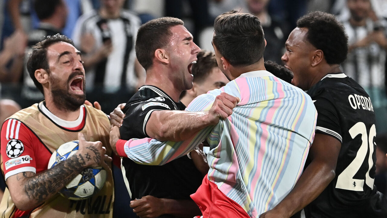 TURIN, ITALY - SEPTEMBER 16: Juventus' Dusan Vlahovic (L) celebrates after scores his team's fourth goal during the League phase UEFA Champions League football match between Juventus and Borussia Dortmund at the Juventus Stadium in Turin, Italy, on September 16, 2025.