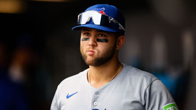 DENVER, CO - AUGUST 6: Bo Bichette #11 of the Toronto Blue Jays walks in the dugout in the second inning against the Colorado Rockies at Coors Field on August 6, 2025 in Denver, Colorado.