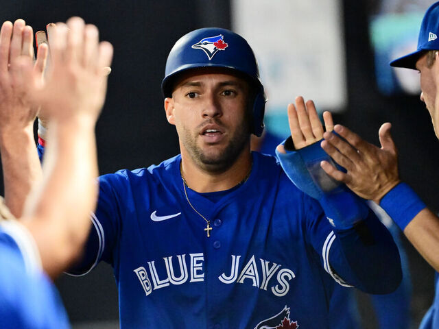 TAMPA, FLORIDA - SEPTEMBER 16: George Springer #4 of the Toronto Blue Jays celebrates with teammates in the dugout after scoring in the first inning against the Tampa Bay Rays at George M. Steinbrenner Field on September 16, 2025 in Tampa, Florida.
