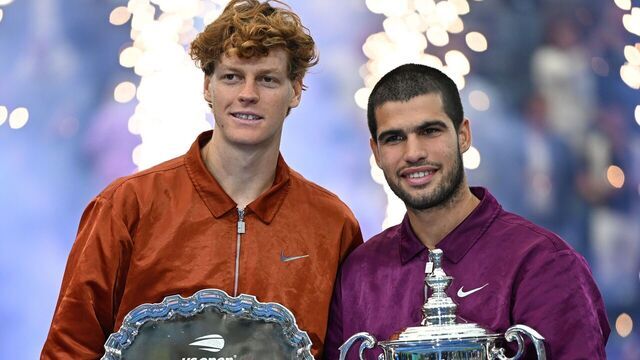 Carlos Alcaraz R of Spain and Jannik Sinner of Italy pose with their trophies during the awarding ceremony after their men's singles final match at the 2025 US Open tennis championships in New York, the United States, Sept. 7, 2025.