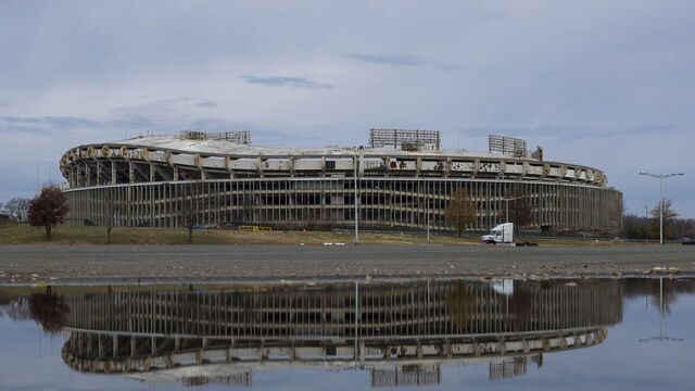 WASHINGTON, DECEMBER 15: Robert F. Kennedy Stadium, reflected against a puddle in Washington, on December 15, 2024. Discussions continue in Congress on legislation that could result in a new Commanders home at RFK.