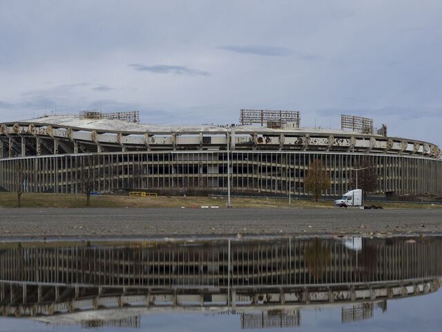 WASHINGTON, DECEMBER 15: Robert F. Kennedy Stadium, reflected against a puddle in Washington, on December 15, 2024. Discussions continue in Congress on legislation that could result in a new Commanders home at RFK.