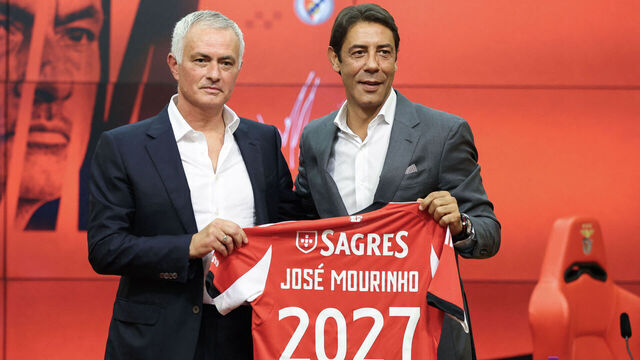 Portuguese coach Jose Mourinho (L) holds up a Benfica jersey with his name together with Benfica president Rui Costa during his official presentation as new Benfica coach at the Benfica Campus training center in Seixal, on the outskirts of Lisbon, on September 18, 2025. Benfica sacked Portuguese coach Bruno Lage following their defeat to Qarabag on September 16, 2025 evening in the Champions League, and contacted Jose Mourinho the next day to hire him.