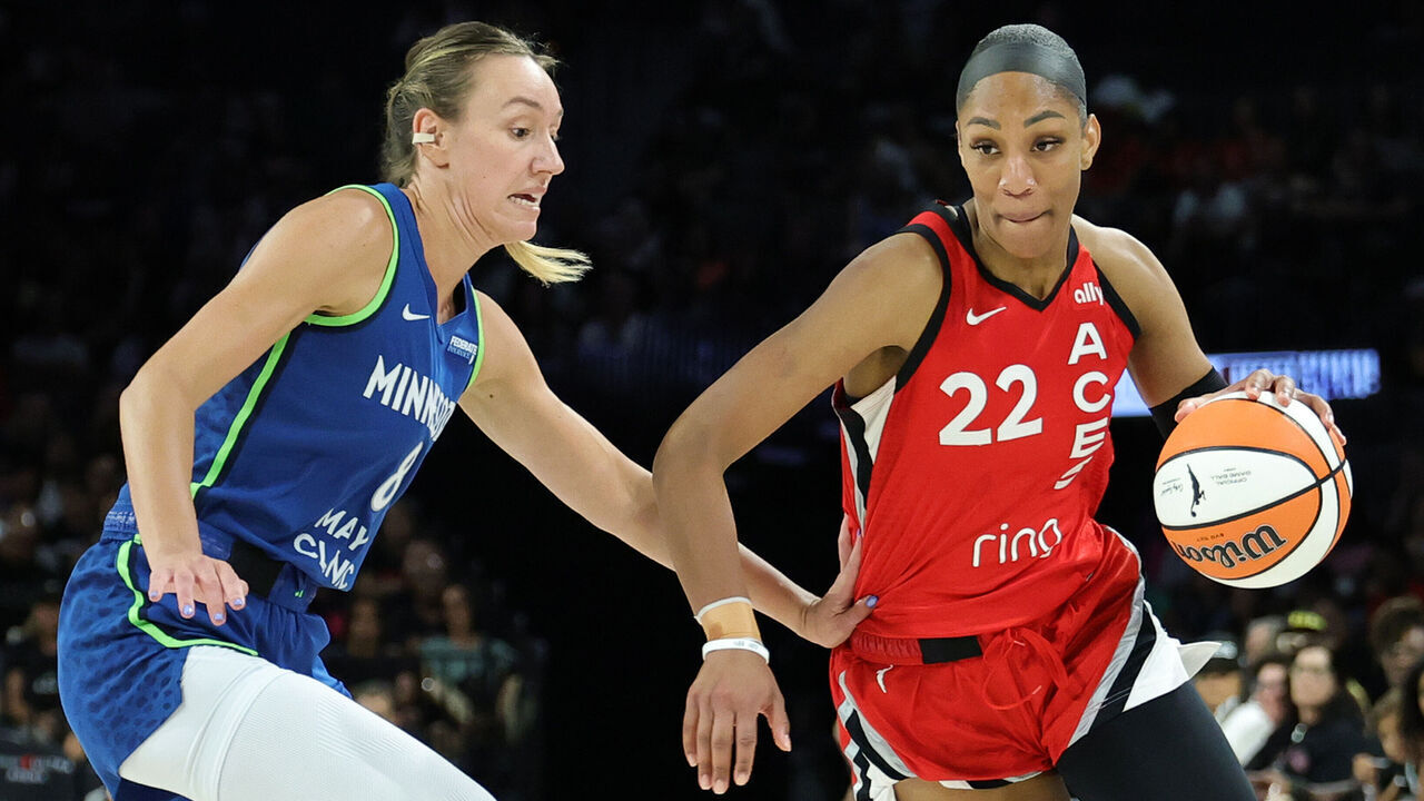 LAS VEGAS, NEVADA - AUGUST 02: A'ja Wilson #22 of the Las Vegas Aces drives against Alanna Smith #8 of the Minnesota Lynx in the third quarter of their game at Michelob ULTRA Arena on August 02, 2025 in Las Vegas, Nevada. The Lynx defeated the Aces 111-58.