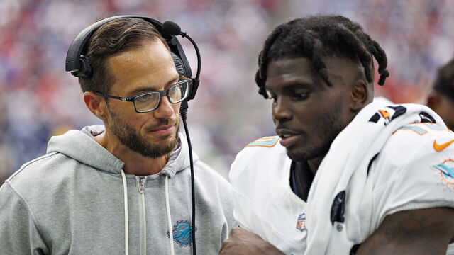 HOUSTON, TEXAS - AUGUST 19: Tyreek Hill #10 talks with Head Coach Mike McDaniel of the Miami Dolphins on the sidelines during the preseason game against the Houston Texans at NRG Stadium on August 19, 2023 in Houston, Texas. The Dolphins defeated the Texans 28-3.
