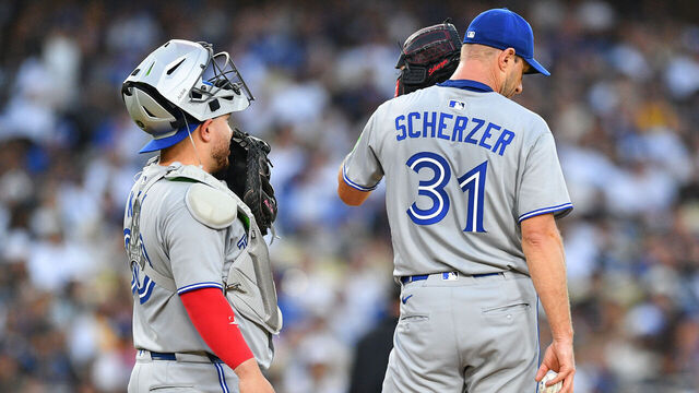 LOS ANGELES, CA - AUGUST 08: Toronto Blue Jays catcher Alejandro Kirk (30) talks with Toronto Blue Jays pitcher Max Scherzer (31) during the MLB game between the Toronto Blue Jays and the Los Angeles Dodgers on August 8, 2025 at Dodger Stadium in Los Angeles, CA.