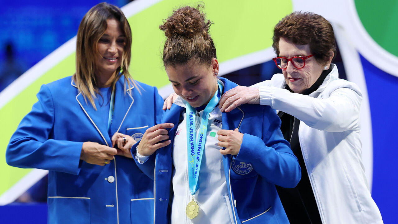 SHENZHEN, CHINA - SEPTEMBER 21: Jasmine Paolini of Italy is presented with their blue blazer from Billie Jean King during the trophy presentation for the Billie Jean King Cup by Gainbridge Finals 2025, Final match between Italy and USA at Shenzhen Bay Sports Centre Arena on September 21, 2025 in Shenzhen, China.