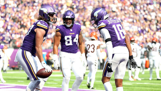 MINNEAPOLIS, MINNESOTA - SEPTEMBER 21: TJ. Hockenson #87 of the Minnesota Vikings celebrates with Justin Jefferson #18 after scoring a touchdown against the Cincinnati Bengals during the third quarter at U.S. Bank Stadium on September 21, 2025 in Minneapolis, Minnesota.