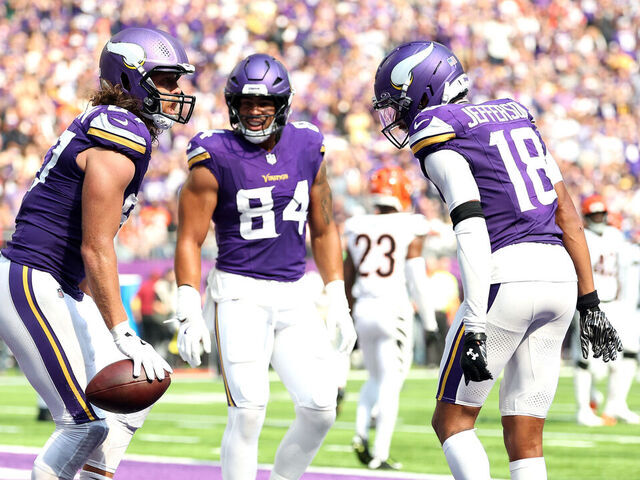 MINNEAPOLIS, MINNESOTA - SEPTEMBER 21: TJ. Hockenson #87 of the Minnesota Vikings celebrates with Justin Jefferson #18 after scoring a touchdown against the Cincinnati Bengals during the third quarter at U.S. Bank Stadium on September 21, 2025 in Minneapolis, Minnesota.