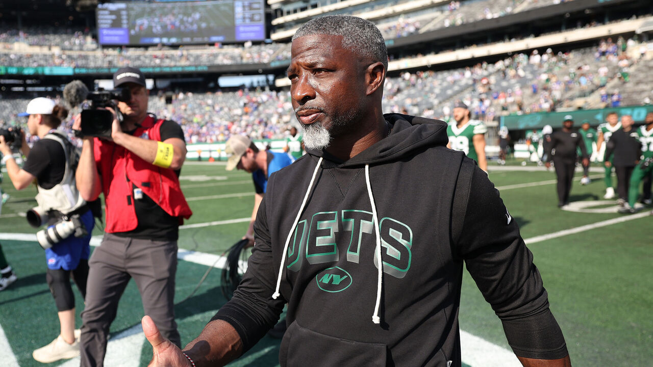EAST RUTHERFORD, NEW JERSEY - SEPTEMBER 14: Head coach Aaron Glenn of the New York Jets walks to meet head coach Sean McDermott of the Buffalo Bills, not pictured, after the Bills beat the Jets 30-10 at MetLife Stadium on September 14, 2025 in East Rutherford, New Jersey.