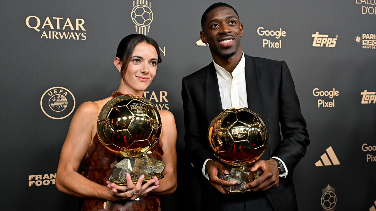 PARIS, FRANCE - SEPTEMBER 22: Aitana Bonmati and Ousmane Dembele pose for a photo with the Women's Ballon d'Or and Men’s Ballon d’Or trophies during the 69th Ballon D'Or Ceremony at Theatre Du Chatelet on September 22, 2025 in Paris, France.