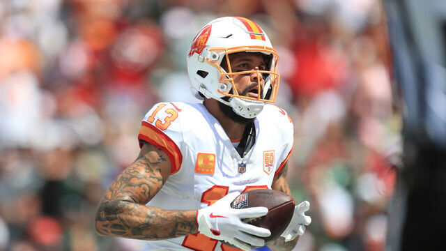 TAMPA, FL - SEPTEMBER 21: Tampa Bay Buccaneers Wide Receiver Mike Evans (13) makes a touchdown grab and then looks for a fan to give the ball to during the Regular Season game between the New York Jets and the Tampa Bay Buccaneers on September 21, 2025 at Raymond James Stadium in Tampa, Florida.