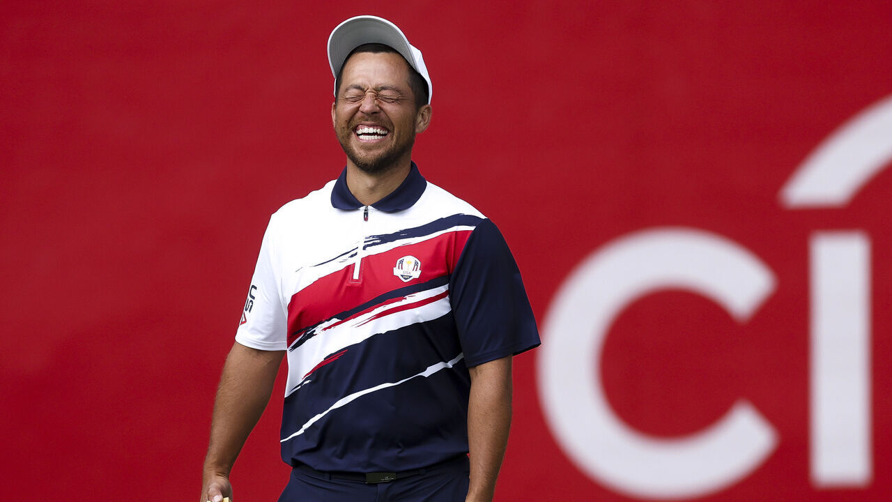 FARMINGDALE, NEW YORK - SEPTEMBER 22: Xander Schauffele of Team United States laughs on the practice putting green prior to the Ryder Cup 2025 at Black Course at Bethpage State Park Golf Course on September 22, 2025 in Farmingdale, New York.