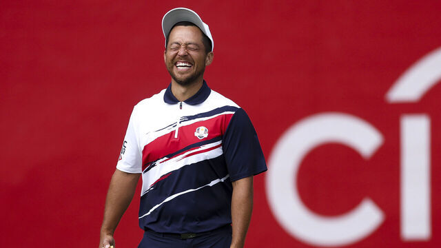 FARMINGDALE, NEW YORK - SEPTEMBER 22: Xander Schauffele of Team United States laughs on the practice putting green prior to the Ryder Cup 2025 at Black Course at Bethpage State Park Golf Course on September 22, 2025 in Farmingdale, New York.