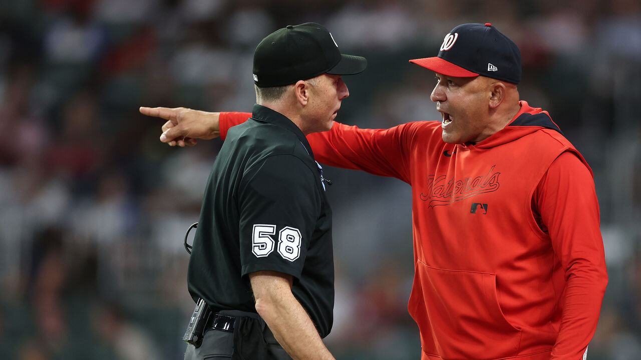 ATLANTA, GEORGIA - SEPTEMBER 22: Interim manager Miguel Cairo #22 of the Washington Nationals reacts to homeplate umpire Dan Iassogna #58 after being ejected by first base umpire Manny Gonzalez #79 in the third inning against the Atlanta Braves at Truist Park on September 22, 2025 in Atlanta, Georgia.