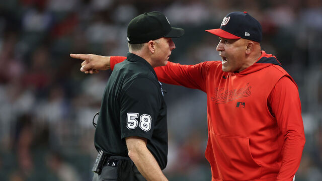 ATLANTA, GEORGIA - SEPTEMBER 22: Interim manager Miguel Cairo #22 of the Washington Nationals reacts to homeplate umpire Dan Iassogna #58 after being ejected by first base umpire Manny Gonzalez #79 in the third inning against the Atlanta Braves at Truist Park on September 22, 2025 in Atlanta, Georgia.