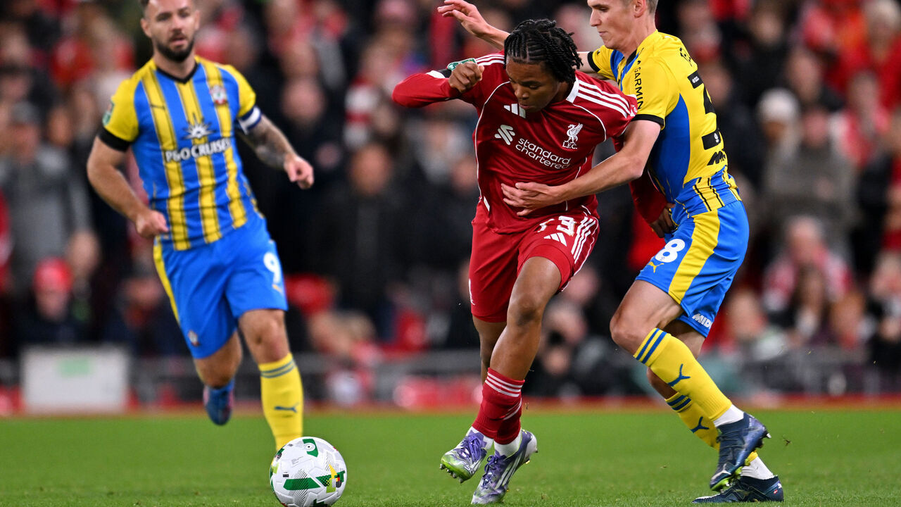 LIVERPOOL, ENGLAND - SEPTEMBER 23: (THE SUN OUT, THE SUN ON SUNDAY OUT) Rio Ngumoha of Liverpool is challenged by Elias Jelert of Southampton during the Carabao Cup Third Round match between Liverpool and Southampton at Anfield on September 23, 2025 in Liverpool, England.