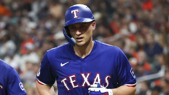 HOUSTON, TX - JULY 12: (left to right) Texas Rangers second baseman Marcus Semien (2) scores on a homer hit by Texas Rangers shortstop Corey Seager (5) during the MLB game between the Texas Rangers and Houston Astros on July 12, 2024 at Minute Maid Park in Houston, Texas.