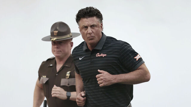 STILLWATER, OK - AUGUST 28: Head coach Mike Gundy of the Oklahoma State Cowboys runs onto the field for a game against the UT Martin Skyhawks at Boone Pickens Stadium on August 28, 2025 in Stillwater, Oklahoma. OSU won 27-7.