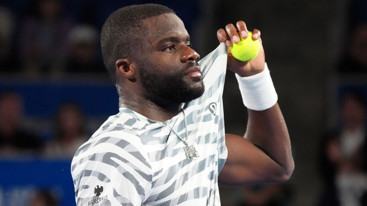TOKYO, JAPAN - SEPTEMBER 24: Frances Tiafoe of the United States looks on Marton Fucsovics of Hungary during the Singles Round of 32 on day one of Kinoshita Group Japan Open at Ariake Colosseum on September 24, 2025 in Tokyo, Japan.
