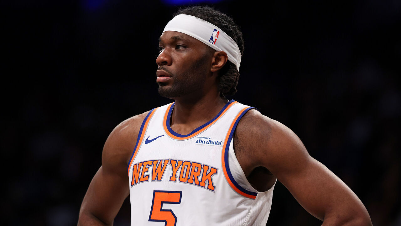 NEW YORK, NEW YORK - APRIL 13: Precious Achiuwa #5 of the New York Knicks looks on during the first half against the Brooklyn Nets at Barclays Center on April 13, 2025 in New York City.