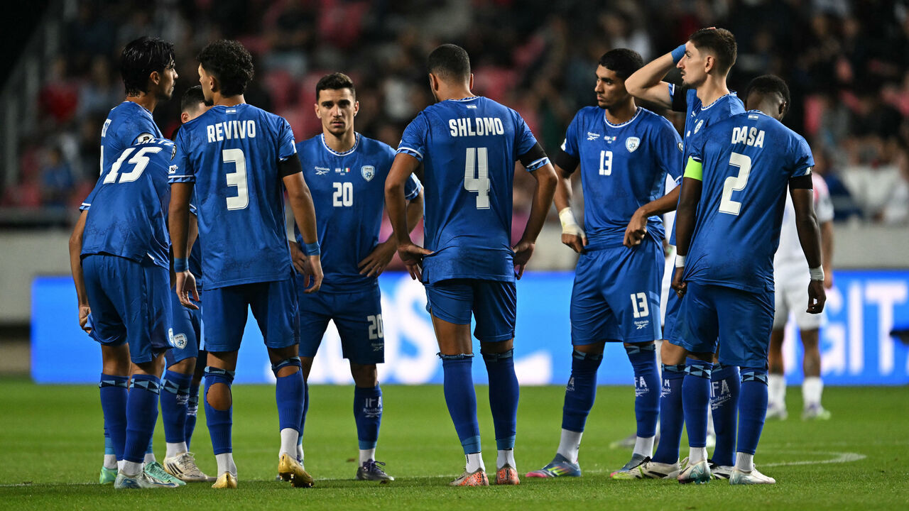 Israel's players are gathered on the field during the 2026 World Cup qualifiers Europe zone group I football match between Israel and Italy on September 8, 2025 in Debrecen, Hungary.