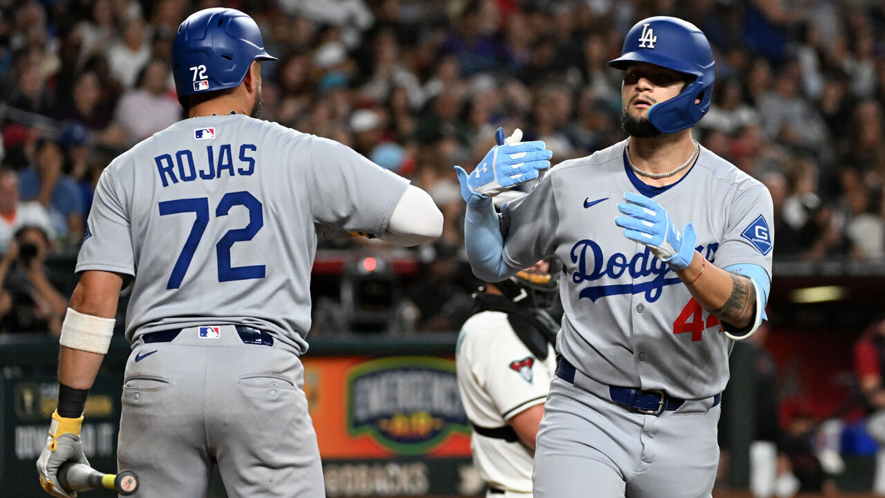 PHOENIX, ARIZONA - SEPTEMBER 24: Andy Pages #44 of the Los Angeles Dodgers celebrates his two-run home run with Miguel Rojas #72 in the fourth inning against the Arizona Diamondbacks at Chase Field on September 24, 2025 in Phoenix, Arizona.