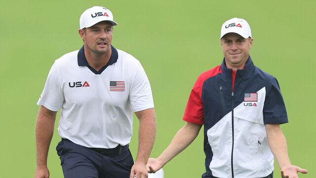 FARMINGDALE, NEW YORK - SEPTEMBER 25: Bryson DeChambeau of Team United States looks on while Justin Thomas of Team United States reacts during a practice round prior to the Ryder Cup 2025 at Black Course at Bethpage State Park Golf Course on September 25, 2025 in Farmingdale, New York.