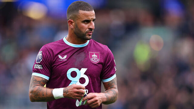 BURNLEY, ENGLAND - SEPTEMBER 14: Kyle Walker of Burnley puts on the captains armband during the Premier League match between Burnley and Liverpool at Turf Moor on September 14, 2025 in Burnley, England.