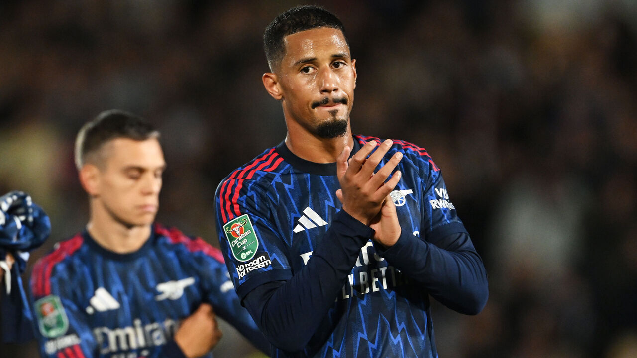 BURSLEM, ENGLAND - SEPTEMBER 24: William Saliba of Arsenal applauds the fans at full-time following the team's victory in the Carabao Cup Third Round match between Port Vale and Arsenal at Vale Park on September 24, 2025 in Burslem, England.