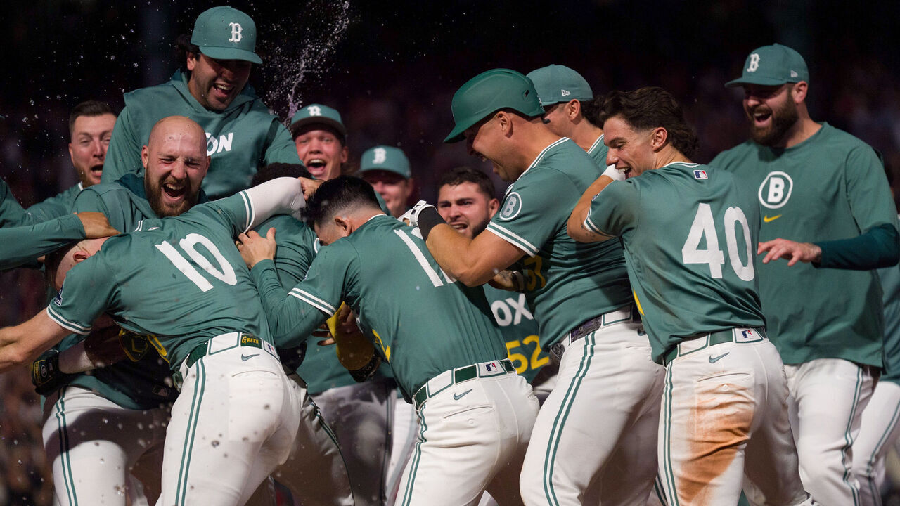 BOSTON, MA - SEPTEMBER 26: Members of the Boston Red Sox celebrate after defeating the Detroit Tigers in a walk-off win to advance to the playoffs at Fenway Park on Friday, September 26, 2025 in Boston, Massachusetts.