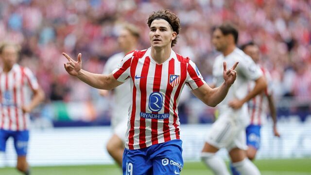 Atletico Madrid's Argentine forward #19 Julian Alvarez celebrates scoring his team's third goal from the penalty spot during the Spanish league football match between Club Atletico de Madrid and Real Madrid CF at the Metropolitano stadium in Madrid on September 27, 2025.