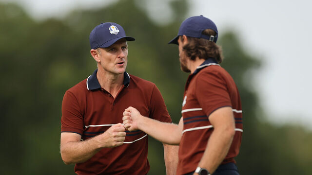 FARMINGDALE, NEW YORK - SEPTEMBER 27: Justin Rose and Tommy Fleetwood of Team Europe celebrate a birdie putt on the 12th green during the Saturday afternoon four-balls matches of the 2025 Ryder Cup at Black Course at Bethpage State Park Golf Course on September 27, 2025 in Farmingdale, New York.