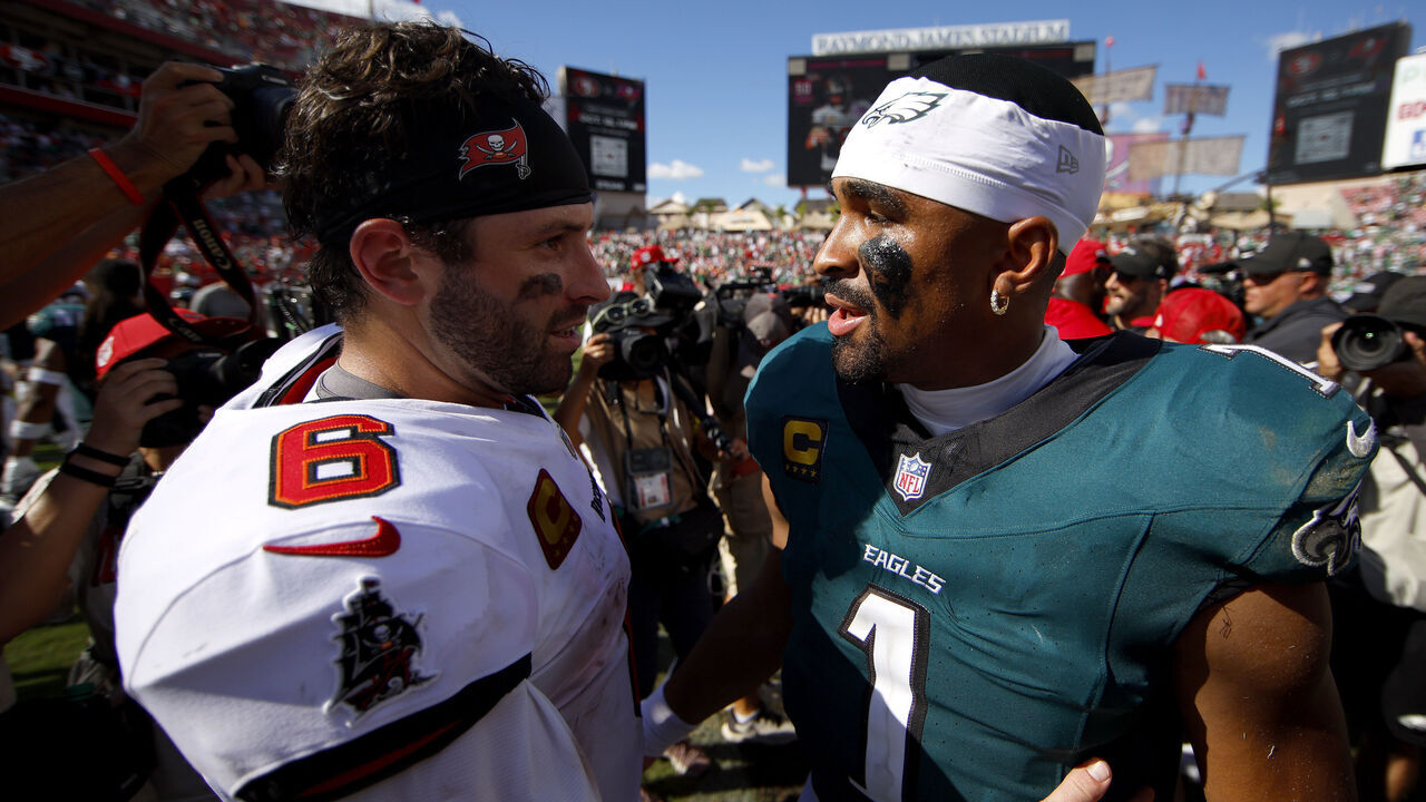 TAMPA, FLORIDA - SEPTEMBER 28: Baker Mayfield #6 of the Tampa Bay Buccaneers and Jalen Hurts #1 of the Philadelphia Eagles embrace after the game at Raymond James Stadium on September 28, 2025 in Tampa, Florida.