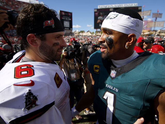 TAMPA, FLORIDA - SEPTEMBER 28: Baker Mayfield #6 of the Tampa Bay Buccaneers and Jalen Hurts #1 of the Philadelphia Eagles embrace after the game at Raymond James Stadium on September 28, 2025 in Tampa, Florida.