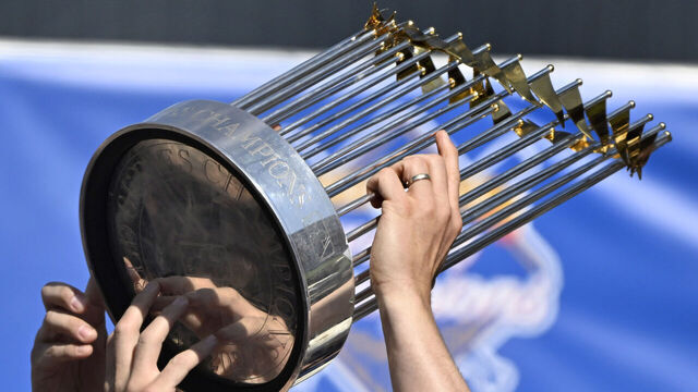 Los Angeles, CA - November 01: Clayton Kershaw of the Los Angeles Dodgers celebrate as he hoists the championship trophy during a celebration of the 2024 World Series Champion Los Angeles Dodgers at Dodger Stadium in Los Angeles on Friday, November 1, 2024.