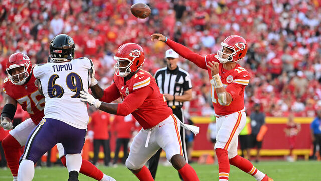 KANSAS CITY, MISSOURI - SEPTEMBER 28: Patrick Mahomes #15 of the Kansas City Chiefs throws a pass for a touchdown during the third quarter against the Baltimore Ravens at Arrowhead Stadium on September 28, 2025 in Kansas City, Missouri.