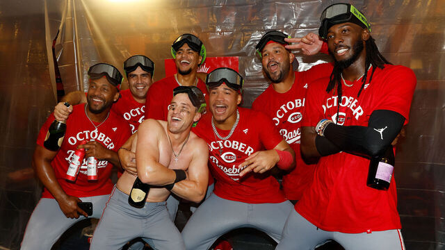 MILWAUKEE, WISCONSIN - SEPTEMBER 28: Elly De La Cruz #44 of the Cincinnati Reds and players celebrate after clinching a playoff berth at American Family Field on September 28, 2025 in Milwaukee, Wisconsin.