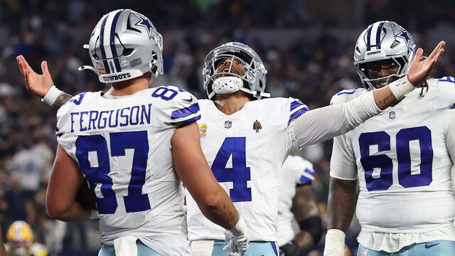 ARLINGTON, TEXAS - SEPTEMBER 28: Dak Prescott #4 of the Dallas Cowboys celebrates throwing a touchdown pass to Jake Ferguson #87 of the Dallas Cowboys against the Green Bay Packers during the third quarter in the game at AT&T Stadium on September 28, 2025 in Arlington, Texas.