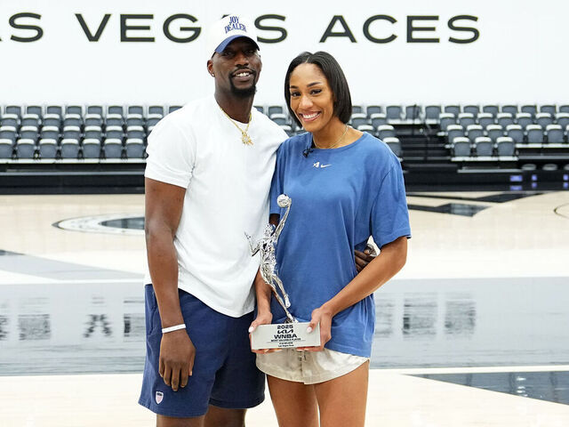 LAS VEGAS, NV - SEPTEMBER 19: A'ja Wilson #22 of the Las Vegas Aces and Bam Adebayo pose with the 2025 Kia WNBA Most Valuable Player award on September 19, 2025 at the Las Vegas Aces practice facility in Henderson, Nevada. Mandatory Copyright Notice: Copyright 2025 NBAE