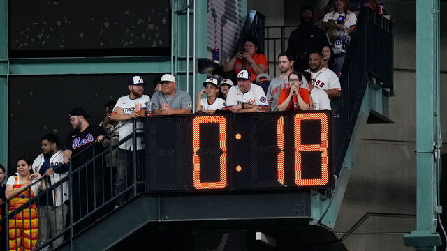 HOUSTON, TX - MARCH 27: Fans watch as the pitch clock is set to 18 seconds during the game between the New York Mets and the Houston Astros at Daikin Park on Thursday, March 27, 2025 in Houston, Texas.