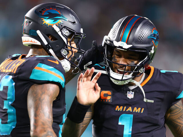 MIAMI GARDENS, FLORIDA - SEPTEMBER 29: Darren Waller #83 and Tua Tagovailoa #1 of the Miami Dolphins celebrate a touchdown during the third quarter against the New York Jets at Hard Rock Stadium on September 29, 2025 in Miami Gardens, Florida.