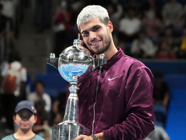 TOKYO, JAPAN - SEPTEMBER 30: Carlos Alcaraz of Spain poses with the trophy after defeating against Taylor Fritz of United States during the Singles Final on day seven of Kinoshita Group Japan Open at Ariake Colosseum on September 30, 2025 in Tokyo, Japan.
