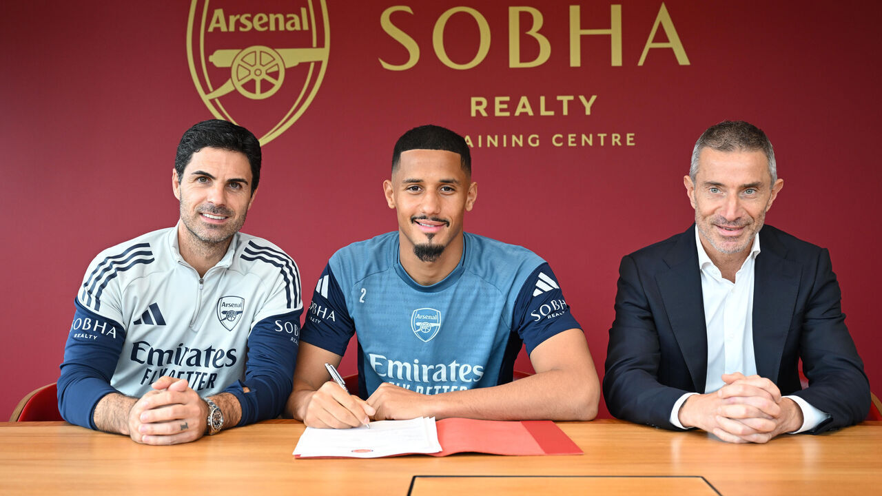 LONDON COLNEY, ENGLAND - SEPTEMBER 30: William Saliba with manager Mikel Arteta and Sporting Director Andrea Berta as he signs a contract extension at Arsenal at Sobha Realty Training Centre on September 30, 2025 in London Colney, England.