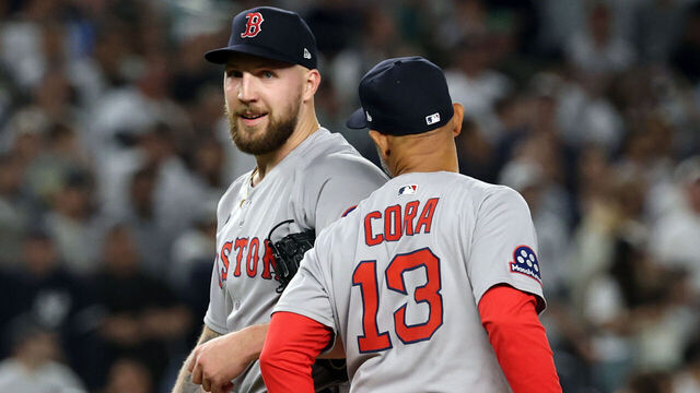 NEW YORK, NEW YORK - SEPTEMBER 30: Garrett Crochet #35 of the Boston Red Sox shakes hands with manager Alex Cora #13 as he is removed from the eighth inning of game one of the American League Wild Card Series against the New York Yankees at Yankee Stadium on September 30, 2025 in the Bronx borough of New York City.