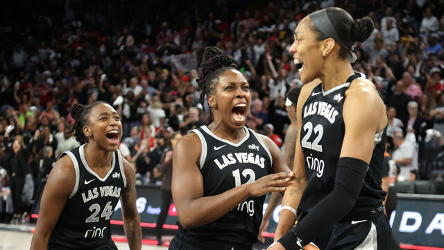 LAS VEGAS, NEVADA - SEPTEMBER 30: Jewell Loyd #24, Chelsea Gray #12 and A'ja Wilson #22 of the Las Vegas Aces celebrate after their 107-98 overtime victory over the Indiana Fever in Game Five of the 2025 WNBA Playoffs semifinals at Michelob ULTRA Arena Michelob ULTRA Arena on September 30, 2025 in Las Vegas, Nevada. The Aces won the series three games to two.