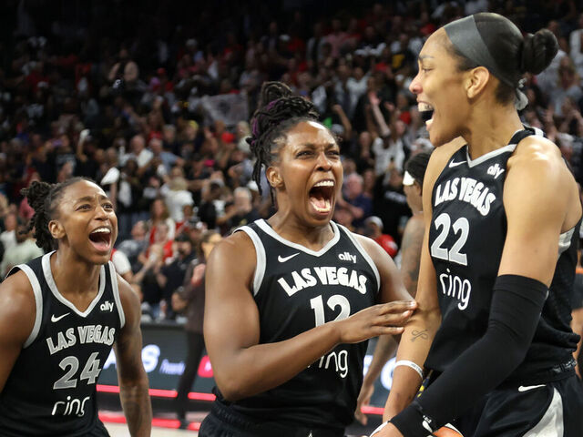 LAS VEGAS, NEVADA - SEPTEMBER 30: Jewell Loyd #24, Chelsea Gray #12 and A'ja Wilson #22 of the Las Vegas Aces celebrate after their 107-98 overtime victory over the Indiana Fever in Game Five of the 2025 WNBA Playoffs semifinals at Michelob ULTRA Arena Michelob ULTRA Arena on September 30, 2025 in Las Vegas, Nevada. The Aces won the series three games to two.